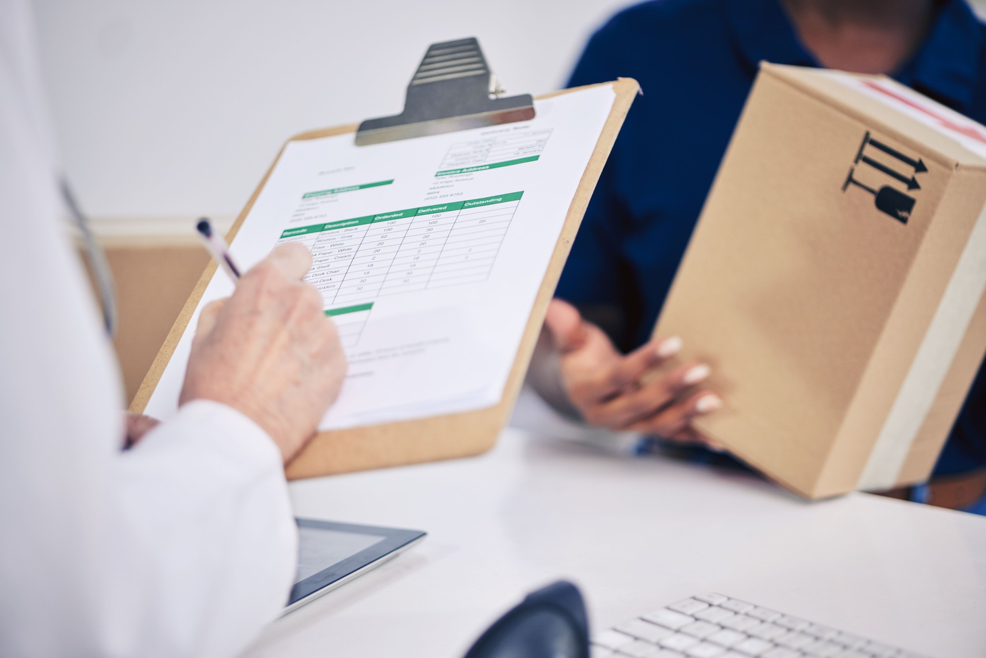 Doctor, delivery and hand with box at pharmacy for signing document with medication or logistics. Healthcare, worker and receive pharmaceutical stock with courier package with service person.